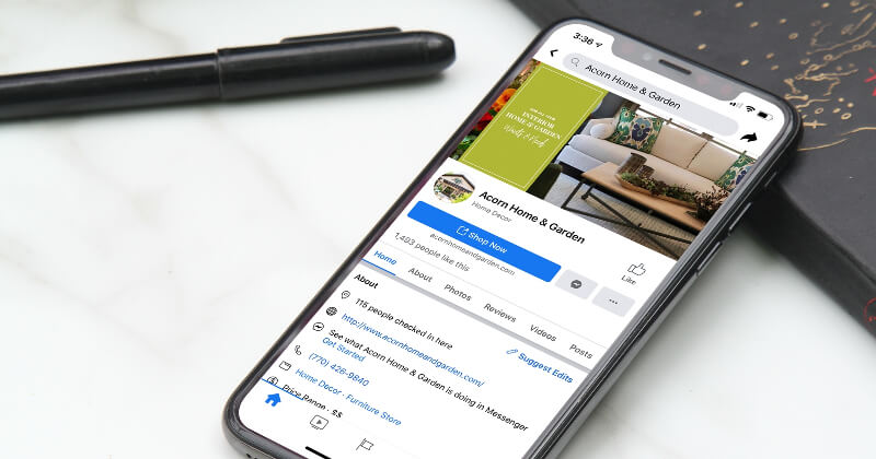 A mobile phone showing a Google listing for Acorn Home and Garden.