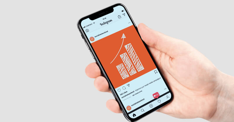 A phone showing SNMD's instagram page